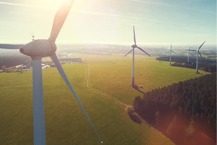 Wind turbines in an open field, representing Nafion™’s sustainability efforts and commitment to renewable energy