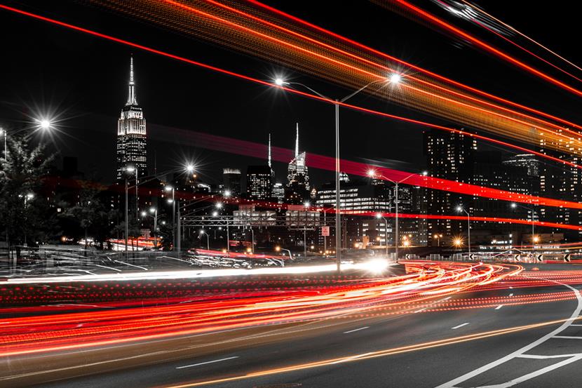Road with vehicle lights streaking across it